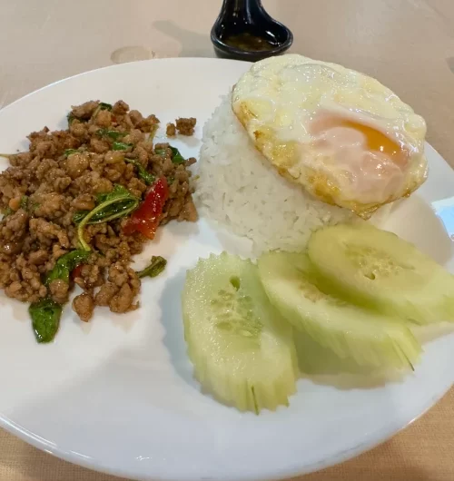 Krapao moo saap Thai minced pork sstir fried with basil over rice